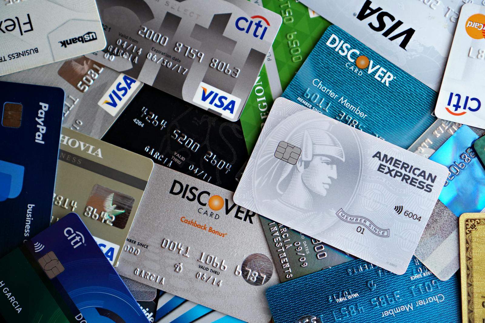 A flat lay of assorted credit and debit cards from various banks. Ideal for finance and banking concepts.